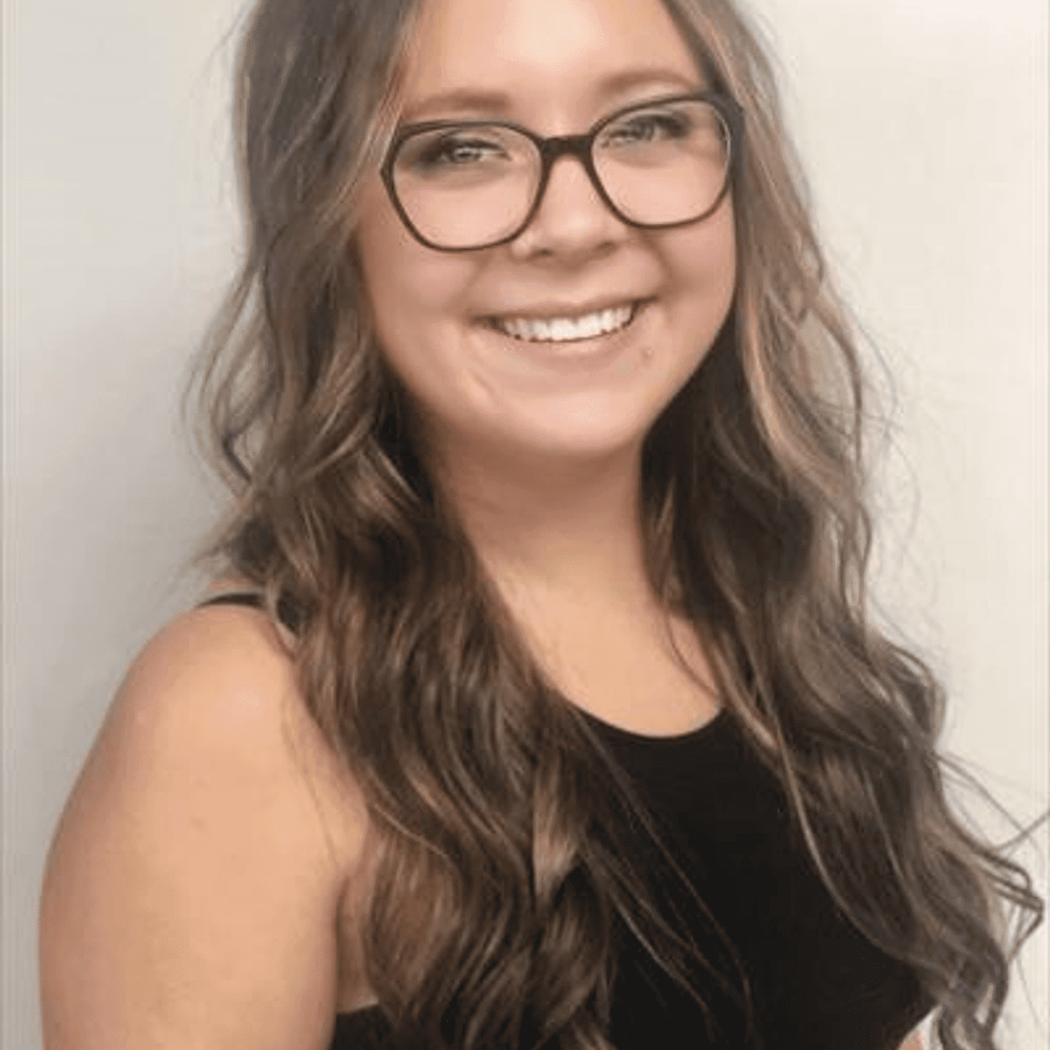 Portrait of Kelsey Beresh, a professional stylist at Snoballs Salon, showcasing their expertise and style.