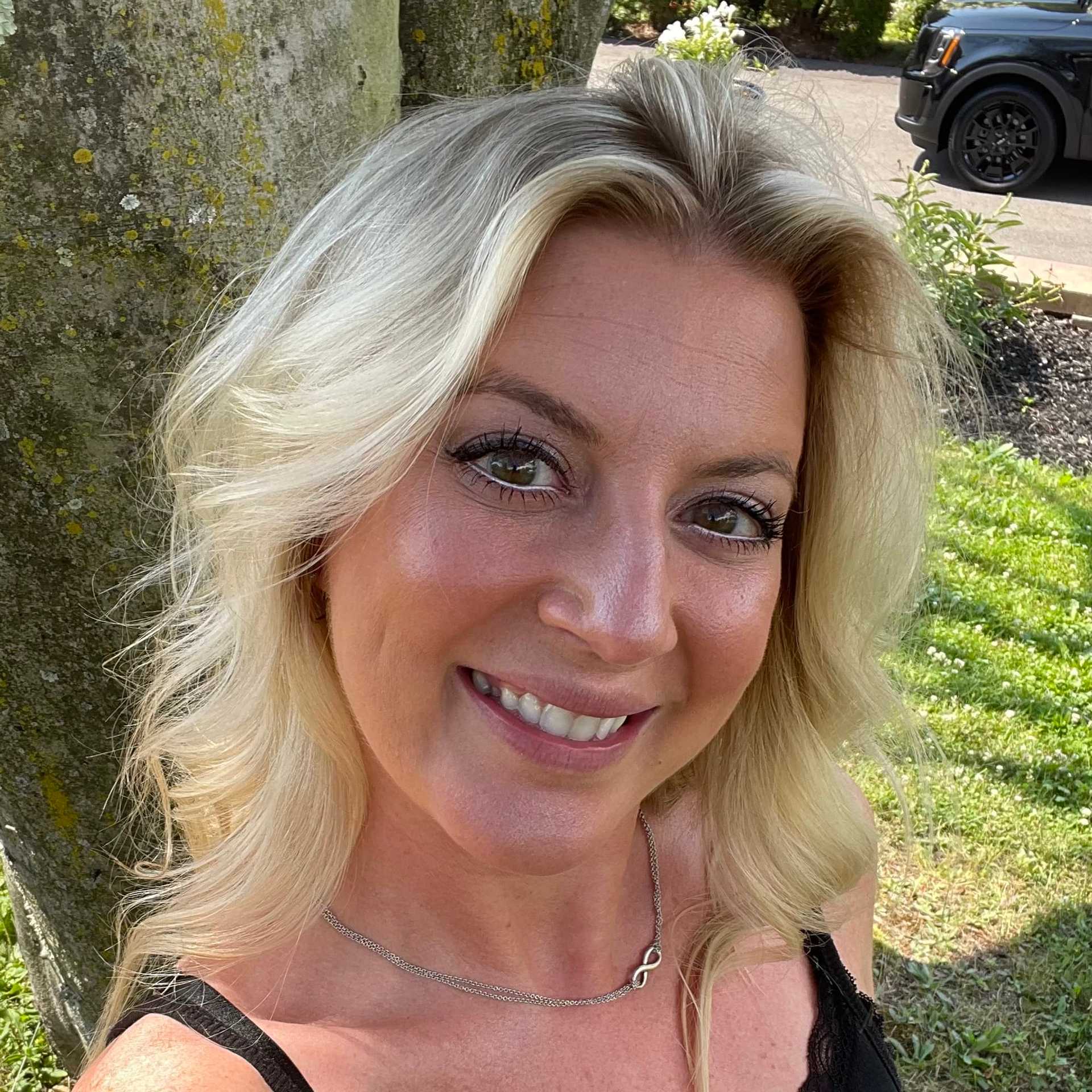 Portrait of Randi Stimak, a professional stylist at Snoballs Salon, showcasing their expertise and style.