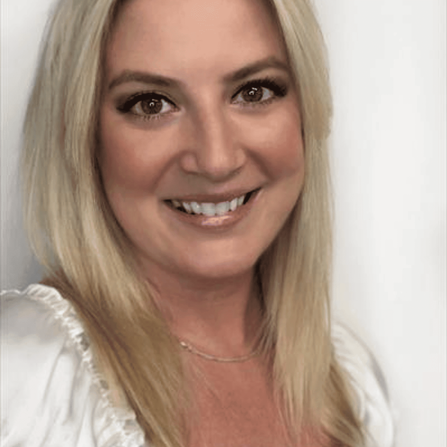 Portrait of Randi Stimak, a professional stylist at Snoballs Salon, showcasing their expertise and style.