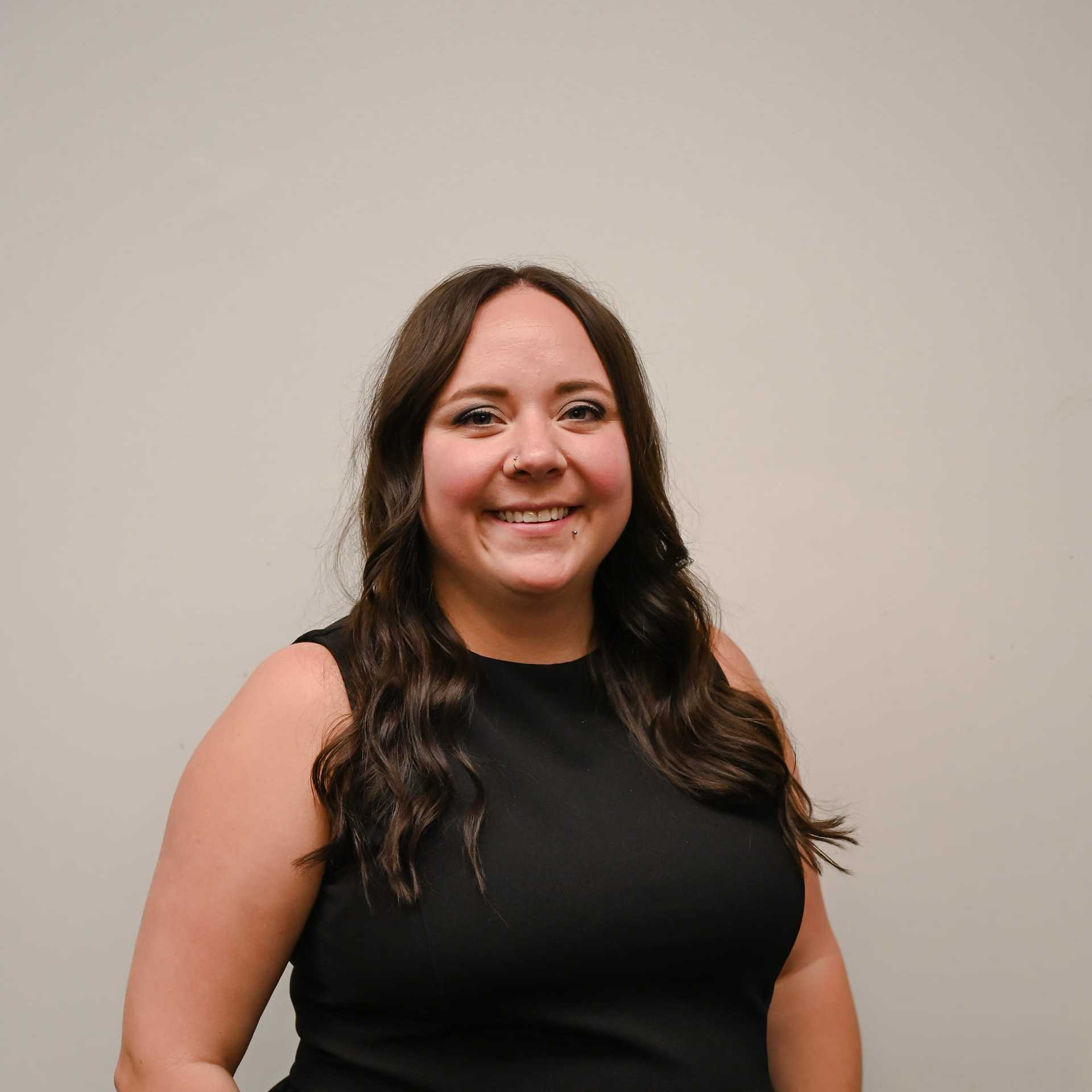 Portrait of Kelsey Beresh, a professional stylist at Snoballs Salon, showcasing their expertise and style.