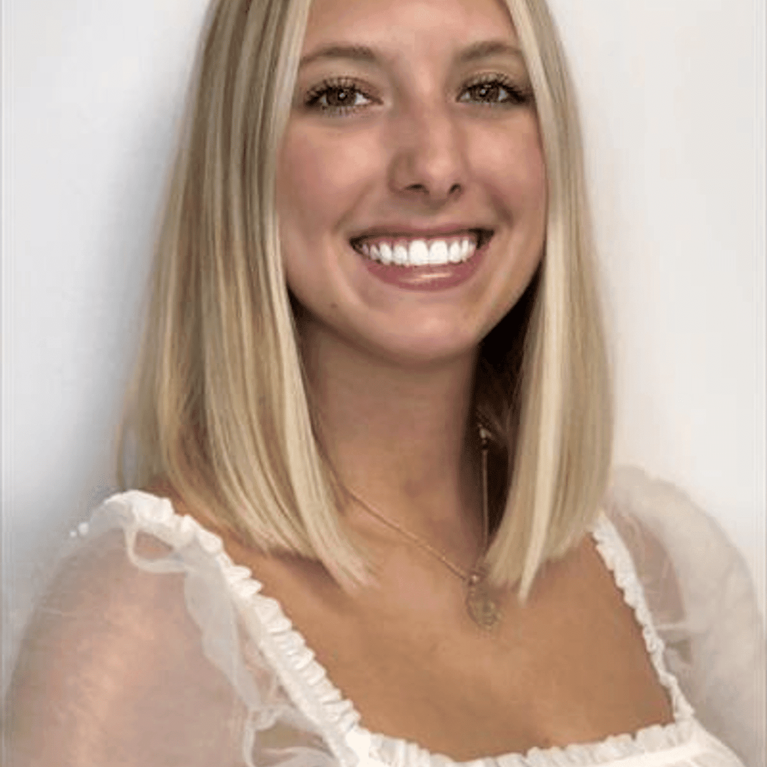 Portrait of Lexi Stobaugh, a professional stylist at Snoballs Salon, showcasing their expertise and style.