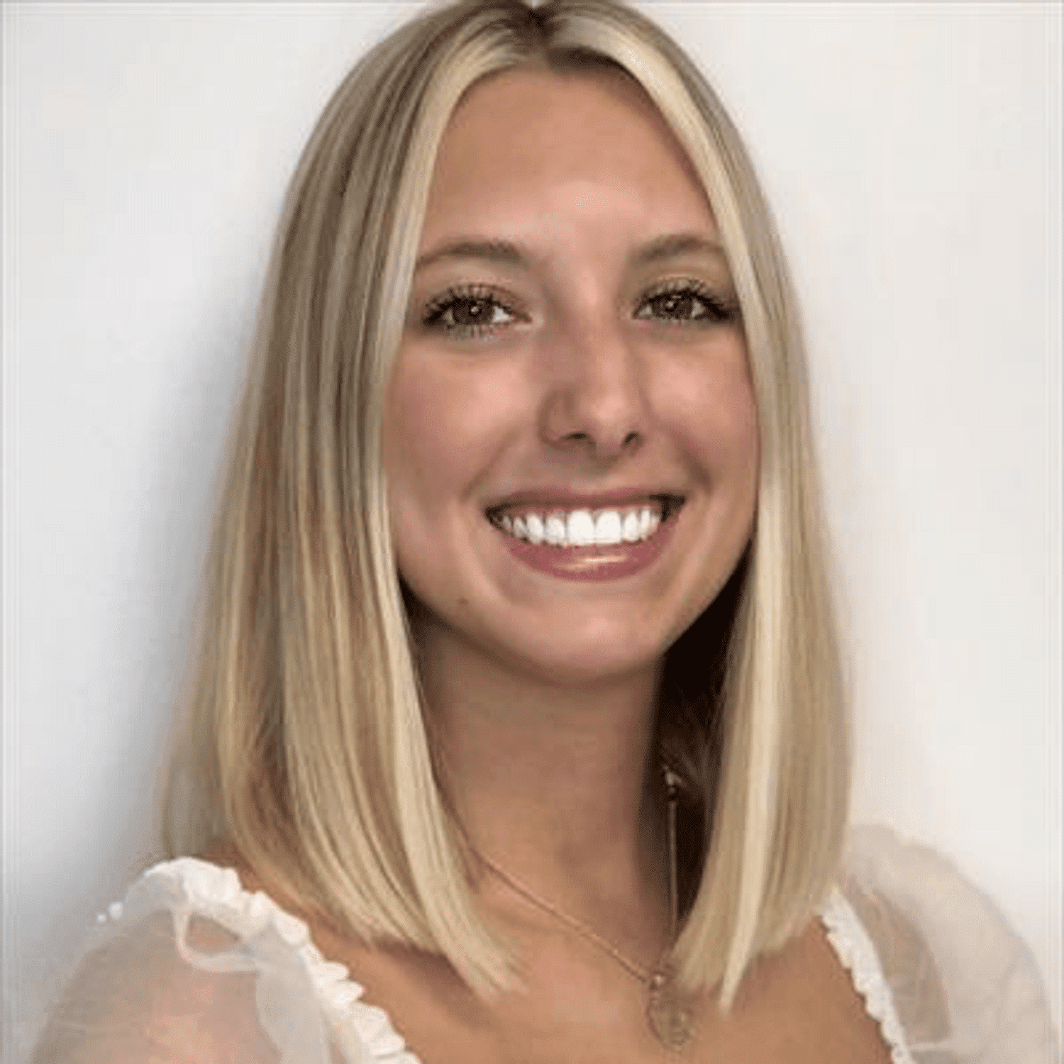 Portrait of Lexi Stobaugh, a professional stylist at Snoballs Salon, showcasing their expertise and style.
