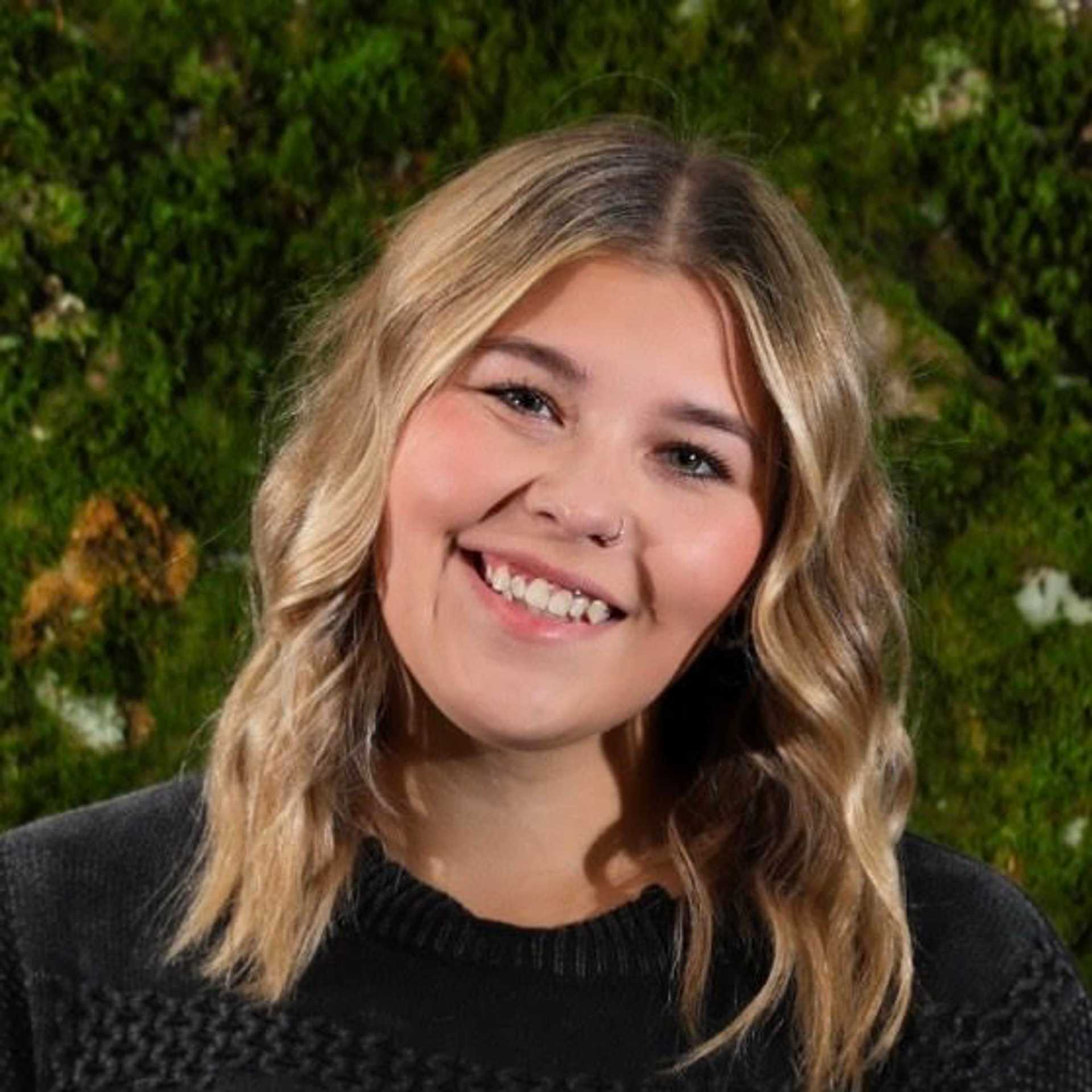 Portrait of Allie Keller, a professional stylist at Snoballs Salon, showcasing their expertise and style.