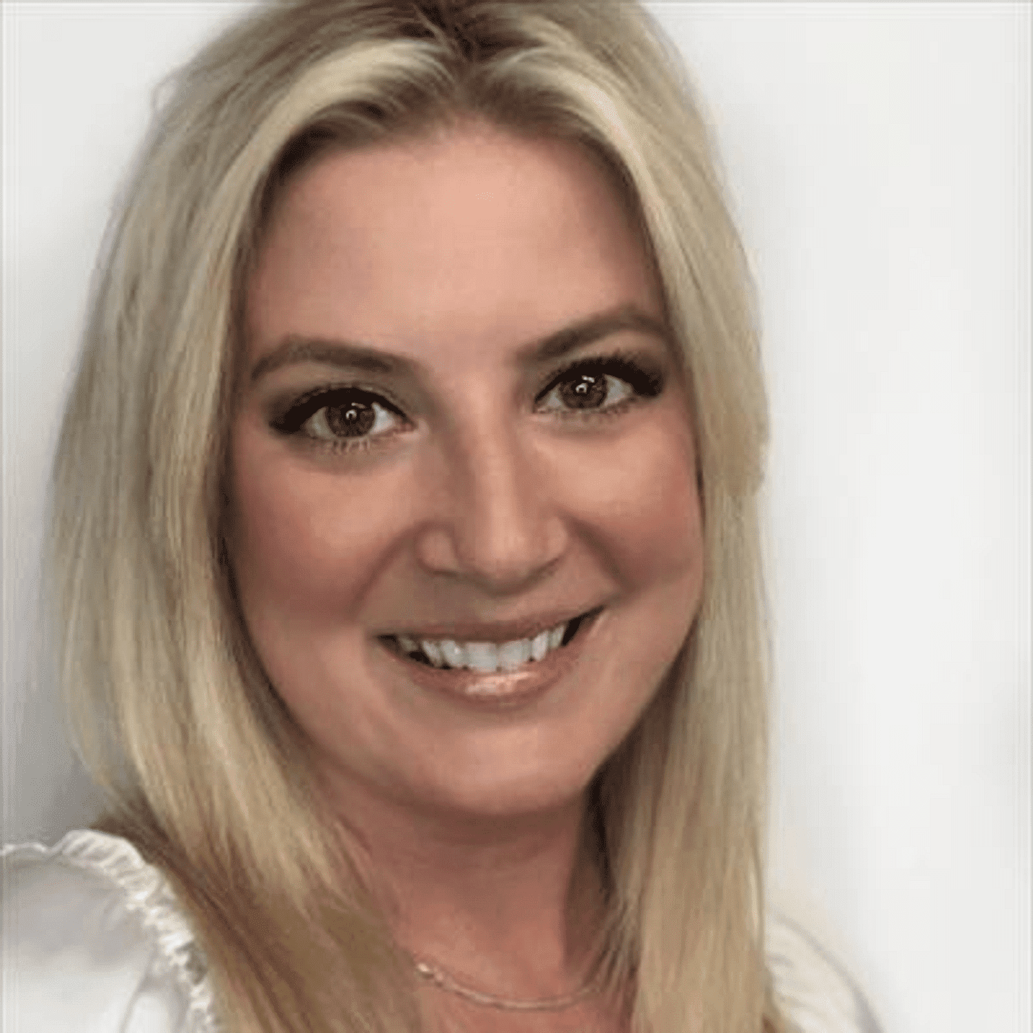 Portrait of Randi Stimak, a professional stylist at Snoballs Salon, showcasing their expertise and style.