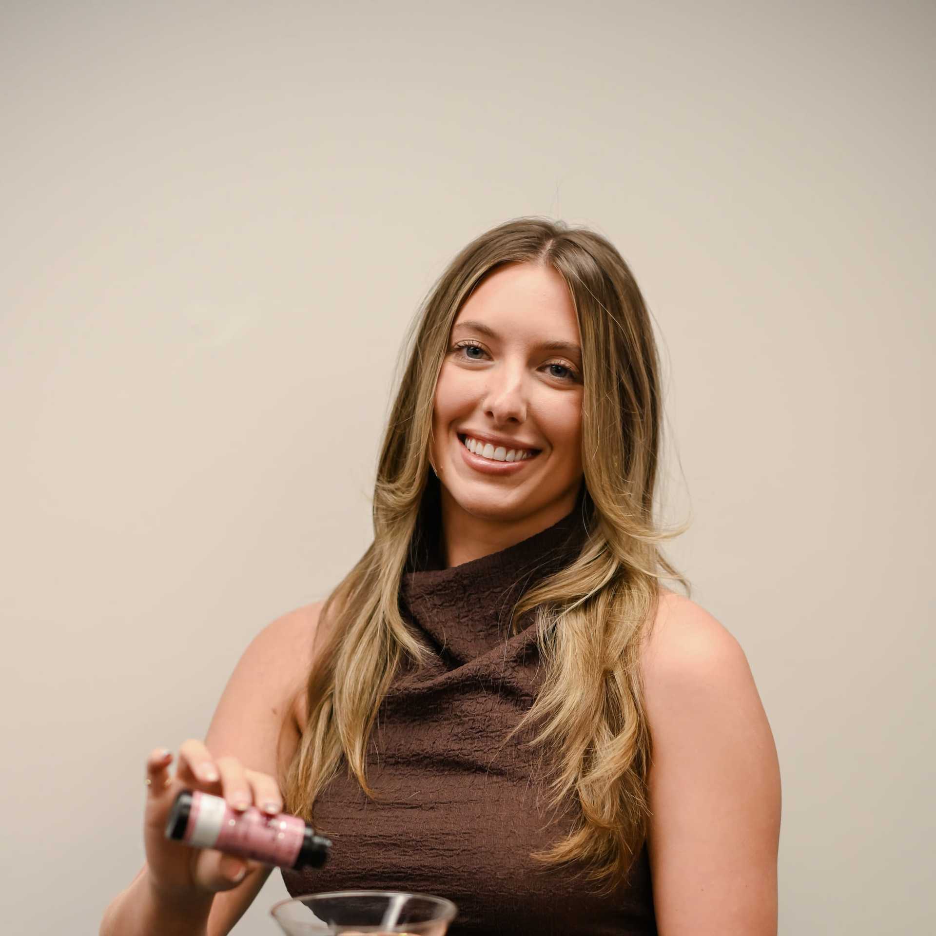 Portrait of Lexi Stobaugh, a professional stylist at Snoballs Salon, showcasing their expertise and style.